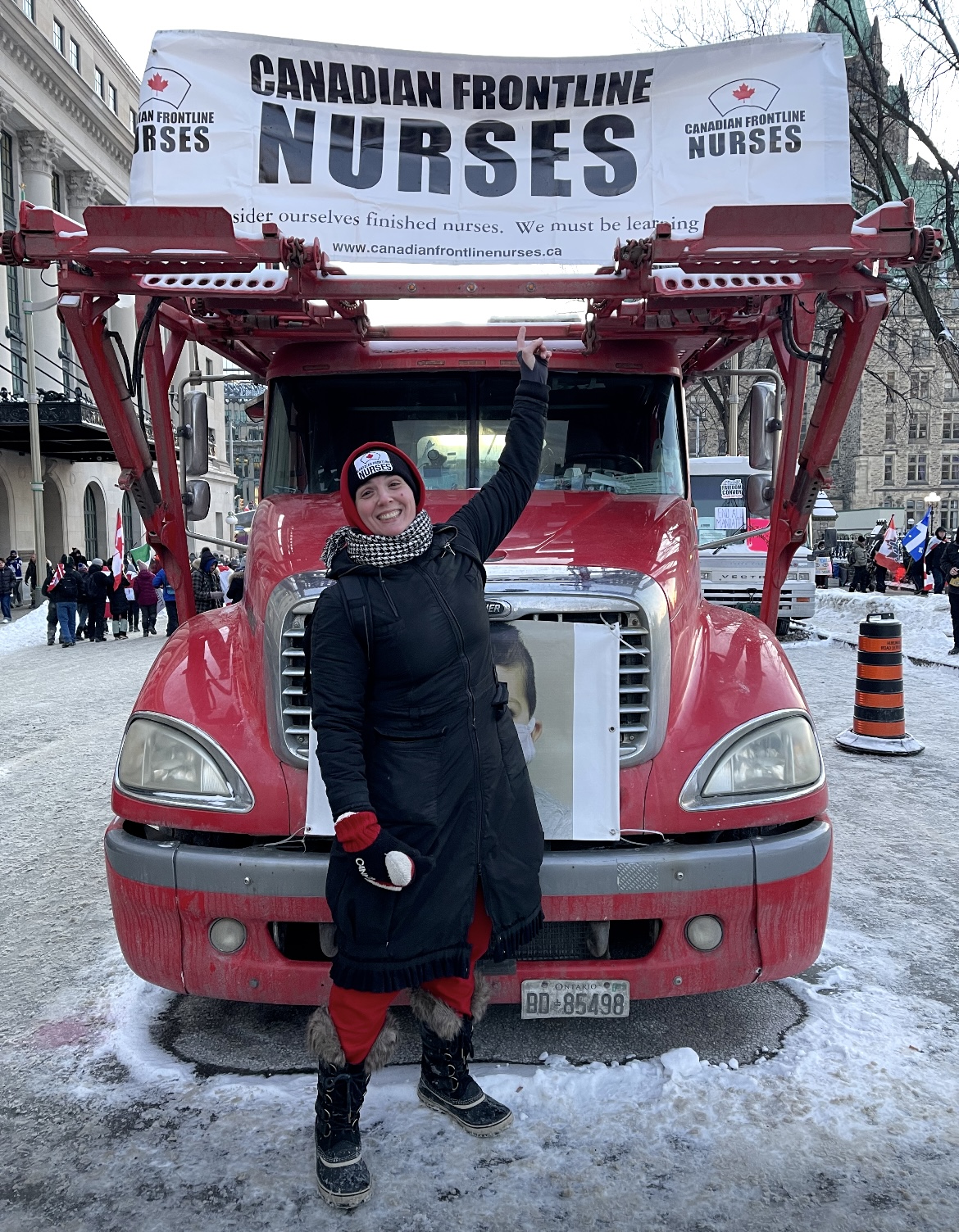 Sarah standing in front of the Canadian Frontline Nurses truck in Ottawa