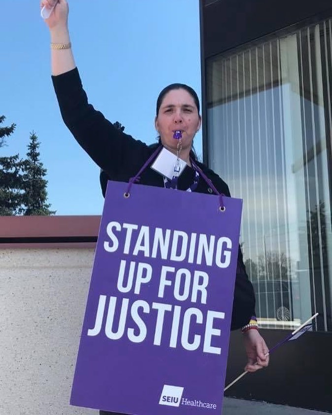 Sarah standing up for justice during her work as a union advocate
