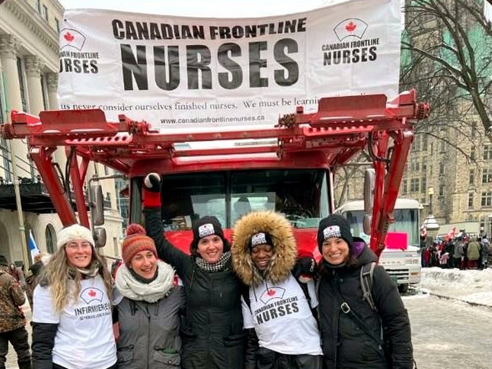 Canadian Frontline Nurses in front of the banner truck